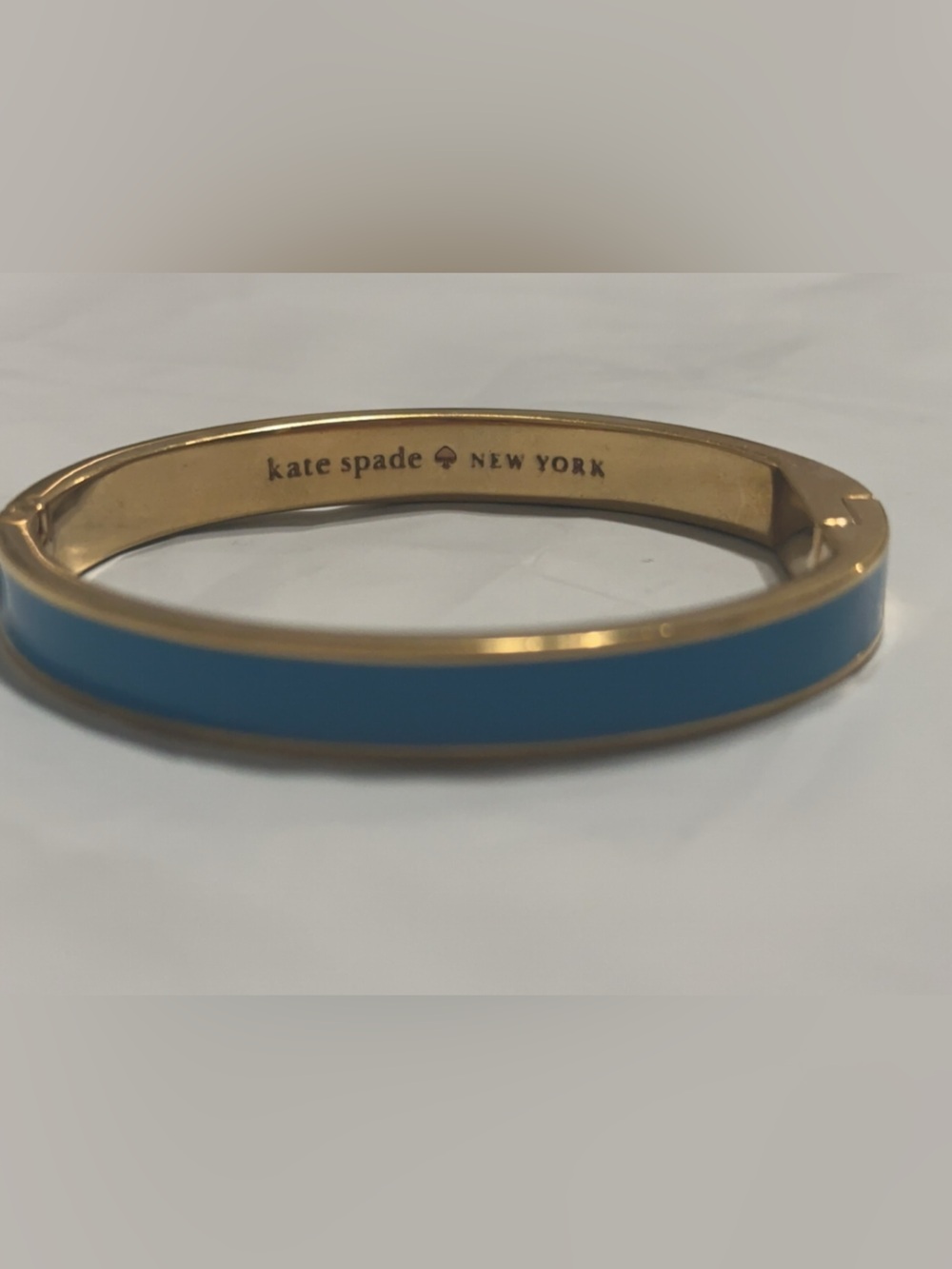kate spade gold-tone bangle with blue enamel